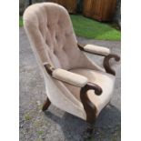 A William IV rosewood upholstered library chair, having turned fluted legs to the front, and sabre