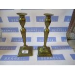 A pair of brass candlesticks