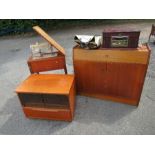 A singer sewing machine and table, music cabinet and a unit, together with an extending dining