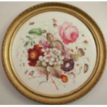 A circular porcelain plaque, painted with flowers, diameter 12ins