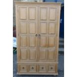 A wardrobe, with fielded panels, height 81ins x width 47ins x depth 21.25ins