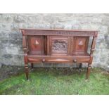 An antique design hutch, the frieze  decorated with script over a carved panel of figures, width