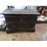 An Eastern low cabinet, with carved decoration, fitted with three drawers, 22ins x 12.5ins, height