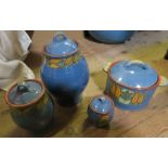 Clio Pottery, three covered jars, and a covered two handled pot, all decorated with leaves to a blue