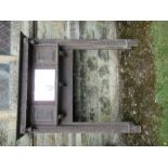 An oak fire surround, having a carved frieze over a mirror flanked by two carved panels, width