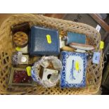 A basket containing clocks, KLM pot, hip flask, etc.