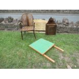 A cane back and seat armchair, together with a cot, corner cabinet and nest of tables