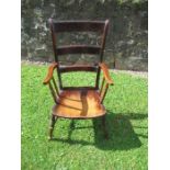 A 19th century country style ladder back arm chair
