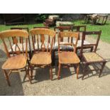 A collection of chairs, including a set of four, three kitchen chairs, and a bedroom chair
