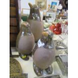 Three pottery and lustre penguin models, one height 13ins, two height 9.5ins