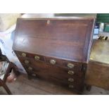An antique oak bureau, width 40ins x height 44ins, together with a gate leg table, height 42ins