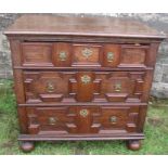 An Antique oak moulded front chest, of three long graduated drawers, raised on bun feet, 33.5ins x