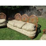 A walnut framed bergere suite, comprising a three seat sofa width 67ins x height 31ins, and two
