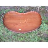 A 19th century mahogany kidney shaped tray, with central inlay decoration, width 24ins