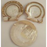 A pair of mother of pearl shells, etched with geometric patterns and traces of gilt decoration,