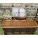 A Rackstraw style coffer, having four fielded panels to the top, and four carved panels to the