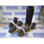 A collection of ornamental shells and grenades