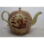 An 18th century creamware teapot, the body and lid decorated in iron reds with reserves of figures