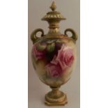A Royal Worcester covered pedestal vase, with dolphin handles, decorated to the front and back