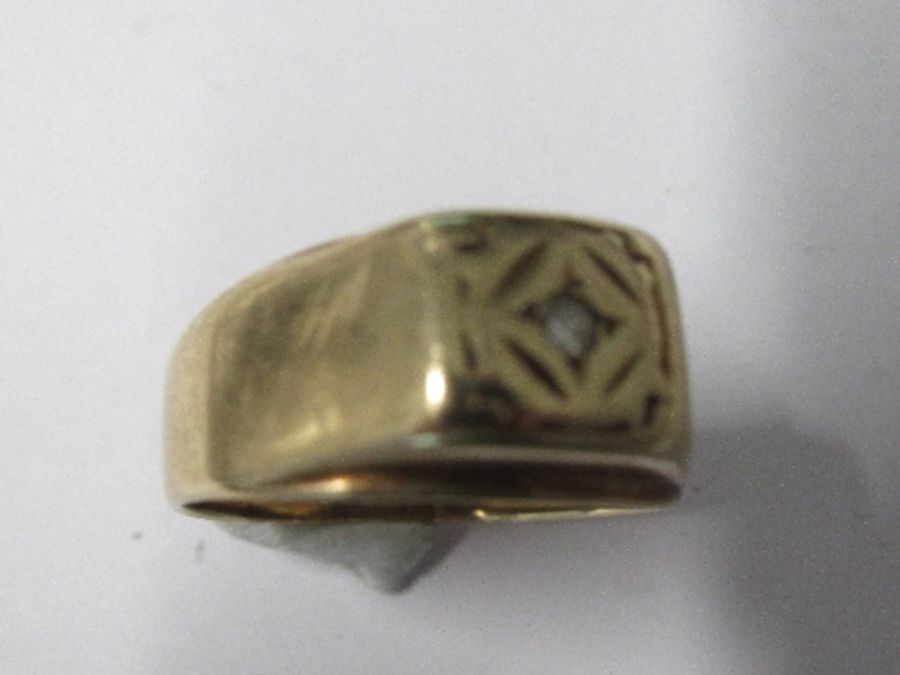 A 9 carat gold ring, set with a small brilliant cut diamond, finger size P, 3.9g gross