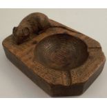 A Robert Mouseman Thompson oak ashtray, carved with a mouse, 4ins x 3ins