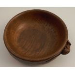 A Robert Mouseman Thompson oak circular bowl, the adze side carved with a mouse, diameter 6ins,