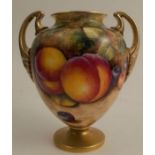 A Royal Worcester pedestal vase, decorated to the front with fruit to a mossy background by R Lynes,