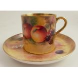 A Royal Worcester coffee can and saucer, painted to the exterior of the can and the saucer with