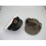 A Royal Navy officer's cap with bullion badge, together with a deerstalker hat by Dunn & Co