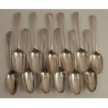 A set of twelve Georgian silver serving spoons, engraved with a crest, London 1782, maker George