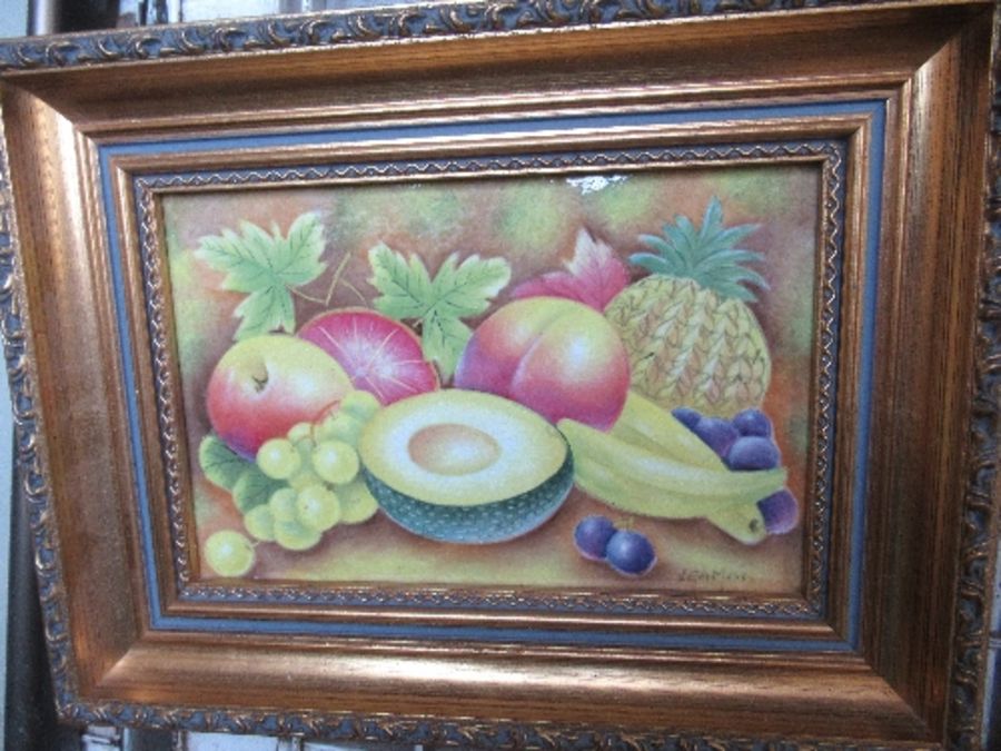 A porcelain plaque, decorated with hand painted fruit, signed Leaman, 5.5ins x 9ins