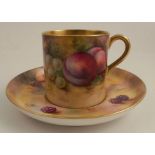 A Royal Worcester coffee can and saucer, painted to the exterior of the can and the saucer with
