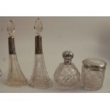 A pair of glass and hallmarked silver dressing table bottles, with glass stoppers, together with two