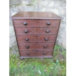 A 19th century late Georgian oak miniature chest of drawers, having five graduated drawers with