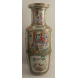 A large Chinese porcelain vase, decorated with panels of figures and birds in the famille rose