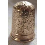 A Charles Horner 9ct gold thimble, with flower head decoration, weight 4g
