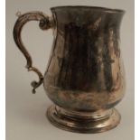 A Georgian silver mug, of baluster form, London 1761, maker Benjamin Cartwright I, weight 10oz,
