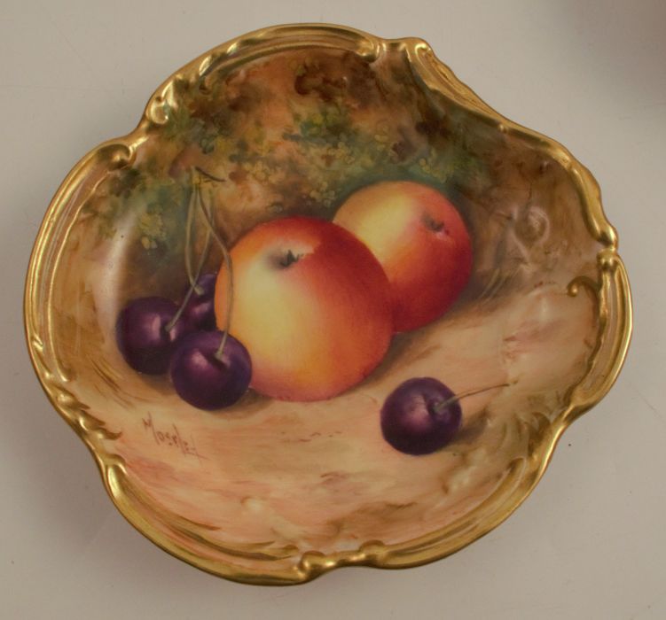 A Royal Worcester dish, with shaped gilt edge, decorated with fruit to a mossy background by