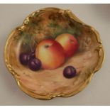 A Royal Worcester dish, with shaped gilt edge, decorated with fruit to a mossy background by