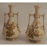 A pair of Royal Worcester ivory vases, in the Persian style, decorated with floral sprays, shape