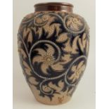 A Royal Doulton bulbous bodied vase, decorated with seaweed and scrolls to a blue ground by George
