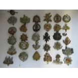 A quantity of British Infantry Regiments of the Line cap badges, to include Bedfordshire,