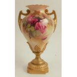 A Royal Worcester pedestal vase, decorated with roses, shape number 1959, dated 1922, height 8.