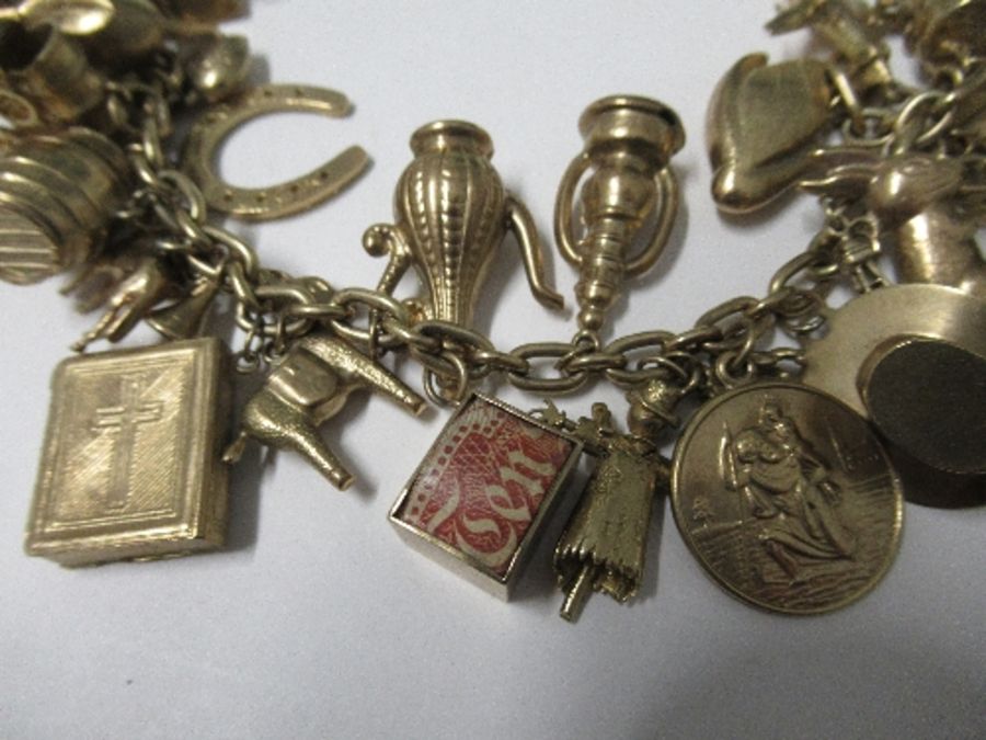 Nineteen hallmarked gold charms, three yellow metal charms, a 1912 heart sovereign and mount, all on - Image 3 of 6