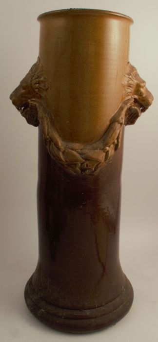 An Art Pottery stick stand, with lion's mask handles of inverted trumpet form, height 22ins one of