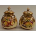 A pair of Royal Worcester quarter lobed covered pot pourri, decorated with hand painted fruit by S