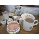 A collection of 12 pieces of Poole pottery, comprising jugs, plate, shallow bowls, etc. the