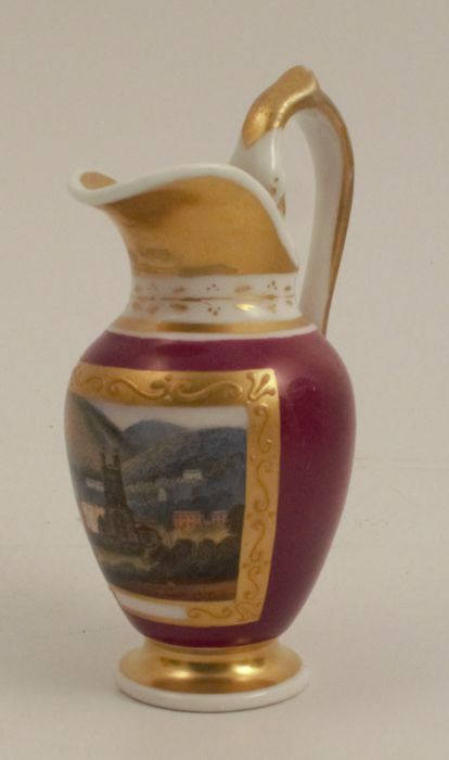 A Chamberlains Worcester miniature jug, decorated with a landscape panel with Malvern Priory and the