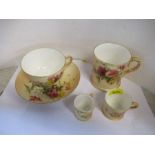 A Royal Worcester tea cup and saucer, together with three mugs, heights 3ins and down, all decorated
