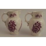 A pair of Royal Worcester leaf moulded jugs, with mask spouts, the moulded body decorated with